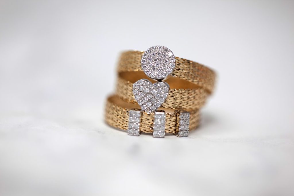 three gold colored studded rings zzlhoewgcem.jpeg